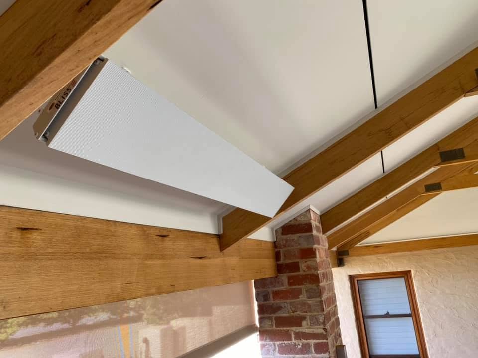 Outdoor strip heater installed under timber beams