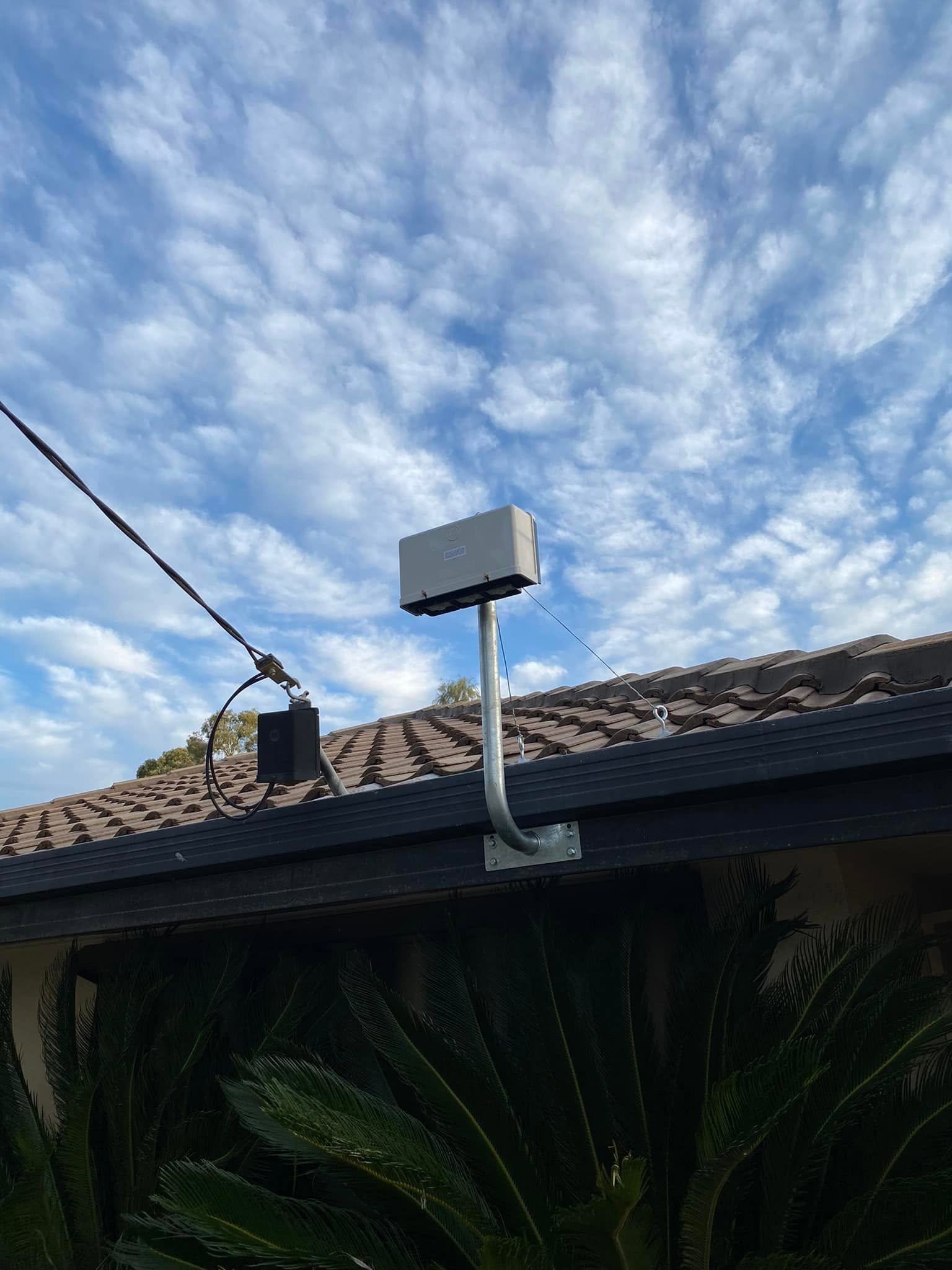 TV antenna installed on a tiled roof